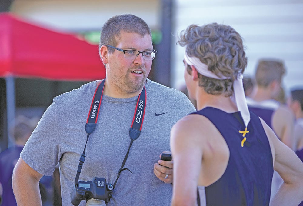 Tyson Agler talks to Concordia cross country runner Ryan Garvey